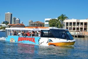 Aquaduck Duck Bus on the Gold Coast waters with customers waving out of the windows